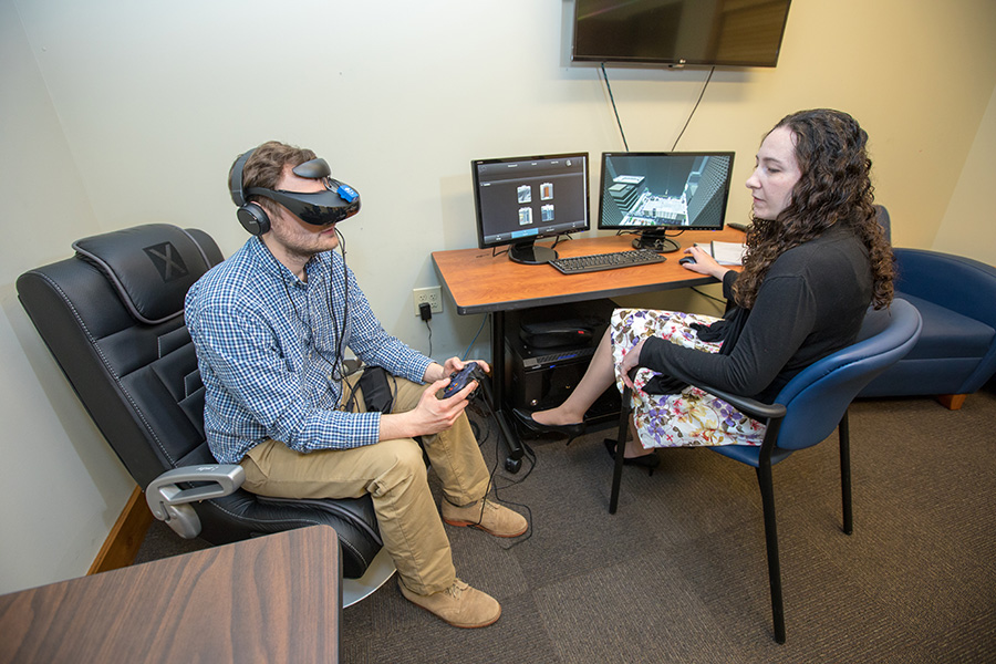 Clinician treating student with the use of VR technology